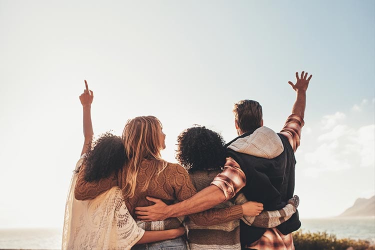 Friends pointing to the sky