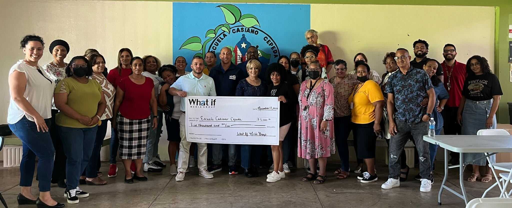 In addition to a $5,000 donation made directly to Escuela Casiano Cepeda by What If Media Group, we were able to donate all of the remaining supplies, which included nearly 20 gallons of paint, paint brushes, a printer, and a projector screen.